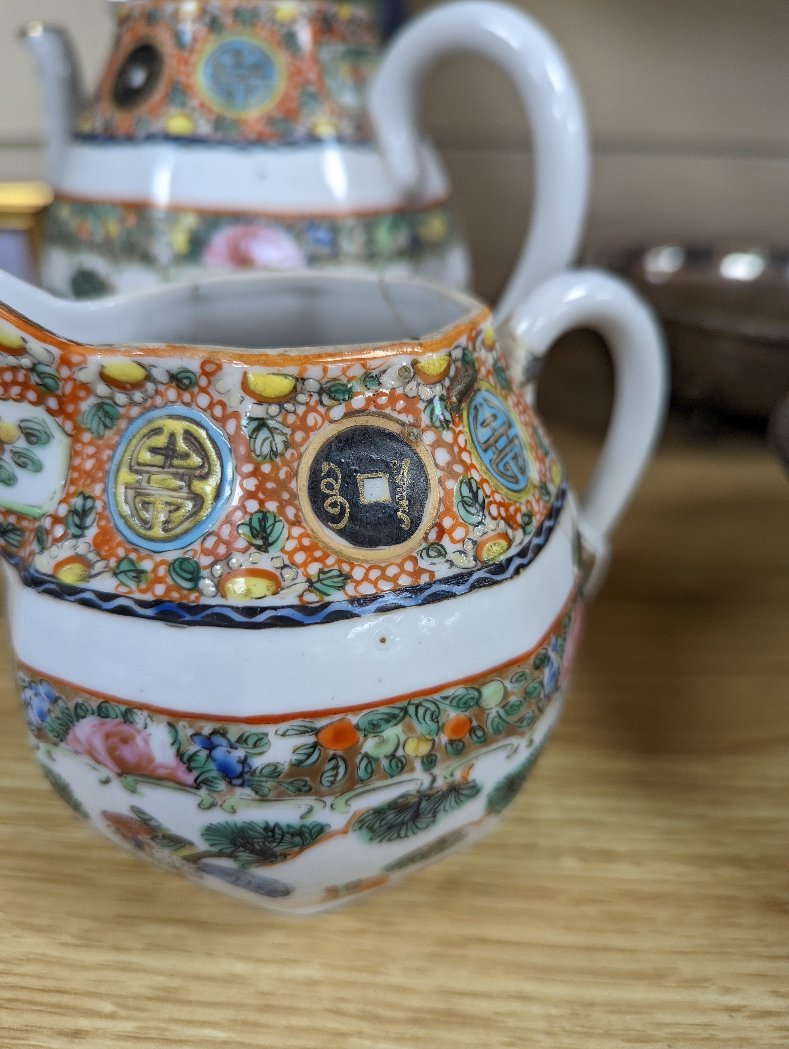 A Chinese celadon glazed vase, 24cm and a Chinese famille rose teapot and matching cream jug, a.f.